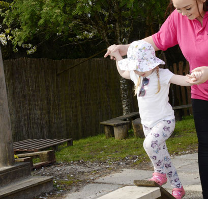 child with nursery worker in nursery Glasgow